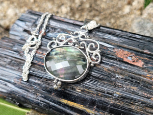 Rainbow Tahitian Mother Of Pearl With A Clear Quartz Topper