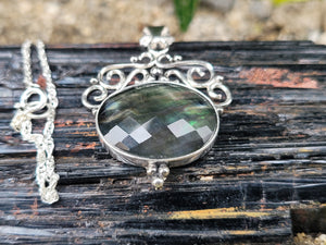 Rainbow Tahitian Mother Of Pearl With A Clear Quartz Topper