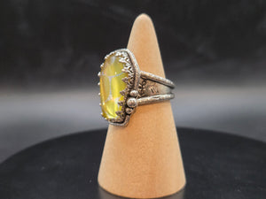 Metallic Gold With A Rainbow Inlay Topped With A Clear Quartz