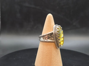 Metallic Gold With A Rainbow Inlay Topped With A Clear Quartz