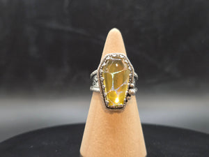 Metallic Gold With A Rainbow Inlay Topped With A Clear Quartz