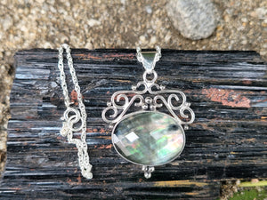 Rainbow Tahitian Mother Of Pearl With A Clear Quartz Topper